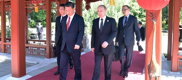 May 14, 2017. President Vladimir Putin and President of China Xi Jinping, right, during a walk after the Russia-China talks at the One Belt, One Road international forum. May 14, 2017. President Vladimir Putin and President of China Xi Jinping, right, during a walk after the Russia-China talks at the One Belt, One Road international forum. - Sputnik International