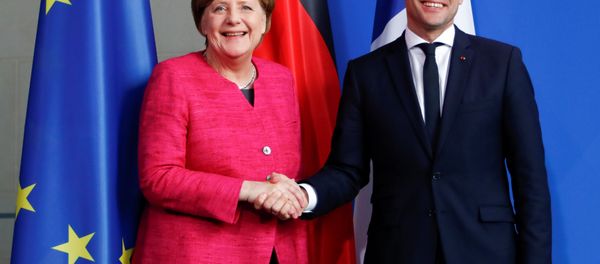 German Chancellor Angela Merkel and French President Emmanuel Macron shake hands after a news conference at the Chancellery in Berlin, Germany, May 15, 2017. German Chancellor Angela Merkel and French President Emmanuel Macron shake hands after a news conference at the Chancellery in Berlin, Germany, May 15, 2017. - Sputnik International