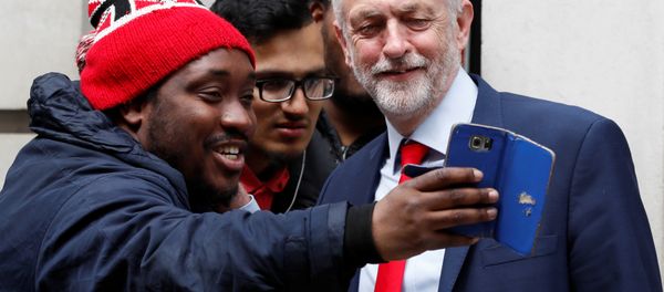 Jeremy Corbyn, the leader of Britain's opposition Labour Party, poses for a selfie as he leaves BBC radio studios in London, May 18, 2017. Jeremy Corbyn, the leader of Britain's opposition Labour Party, poses for a selfie as he leaves BBC radio studios in London, May 18, 2017. - Sputnik International