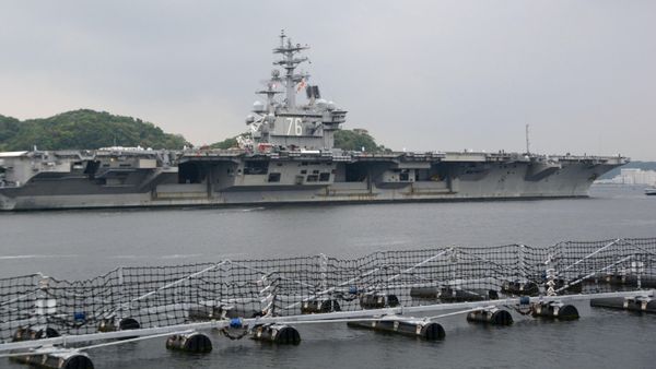 USS Ronald Reagan, a Nimitz-class nuclear-powered supercarrier, leaves from its home port to be deployed in waters near Japan, in Yokosuka, south of Tokyo, Japan, in this photo taken by Kyodo May 16, 2017 - Sputnik International