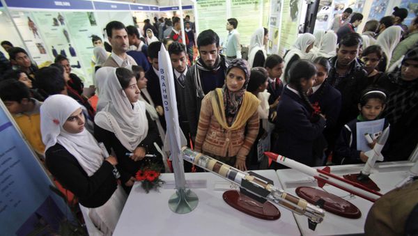 Indian students look at models of missiles in an exhibition by the Indian Defense Research and Development Organization (DRDO) at the 101st Indian Science Congress in Jammu, India, Friday, Feb. 7, 2014 - Sputnik International