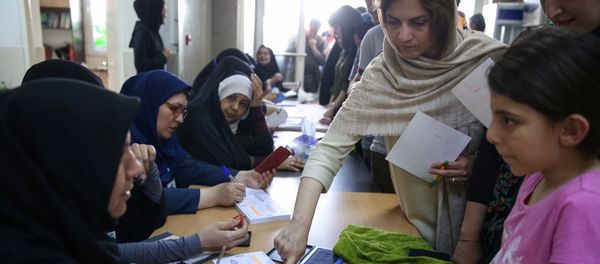 Voters cast their ballots during the presidential election in a Jewish and Christian district in the center of Tehran, Iran, May 19, 2017 Voters cast their ballots during the presidential election in a Jewish and Christian district in the center of Tehran, Iran, May 19, 2017 - Sputnik International