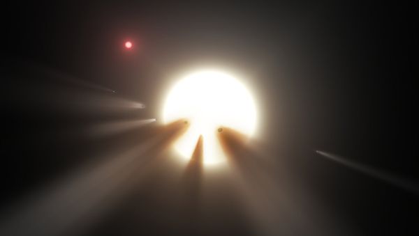 This illustration shows a star behind a shattered comet. Observations of the star KIC 8462852 by NASA's Kepler and Spitzer space telescopes suggest that its unusual light signals are likely from dusty comet fragments, which blocked the light of the star as they passed in front of it in 2011 and 2013 - Sputnik International
