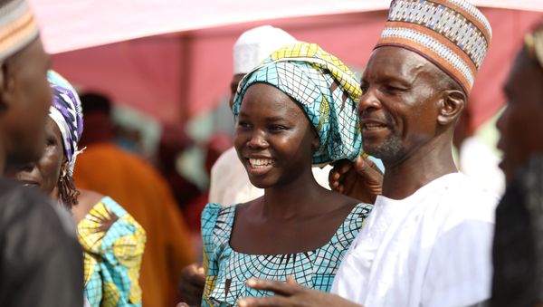 One of the newly released 82 Chibok school girls reunites with her family in Abuja, Nigeria May 20, 2017. - Sputnik International