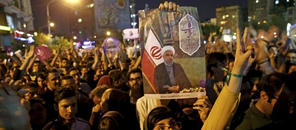 Supporters of Iranian President Hassan Rouhani celebrate after he won the presidential election in Tehran, Iran, Saturday, May 20, 2017 Supporters of Iranian President Hassan Rouhani celebrate after he won the presidential election in Tehran, Iran, Saturday, May 20, 2017 - Sputnik International