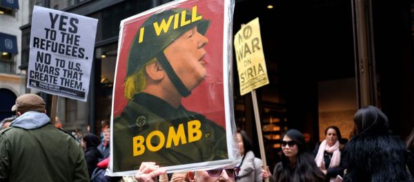 Anti-war protesters shout slogans against US President Donald Trump during a demonstration in front of the Trump Tower in New York on April 7, 2017, to protest the US air strike in Syria Anti-war protesters shout slogans against US President Donald Trump during a demonstration in front of the Trump Tower in New York on April 7, 2017, to protest the US air strike in Syria - Sputnik International