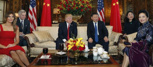President Donald Trump and Chinese President Xi Jinping, sit with their wives, first lady Melania Trump, left, and Chinese first lady Peng Liyuan, right, before a meeting at Mar-a-Lago, Thursday, April 6, 2017, in Palm Beach, Fla President Donald Trump and Chinese President Xi Jinping, sit with their wives, first lady Melania Trump, left, and Chinese first lady Peng Liyuan, right, before a meeting at Mar-a-Lago, Thursday, April 6, 2017, in Palm Beach, Fla - Sputnik International