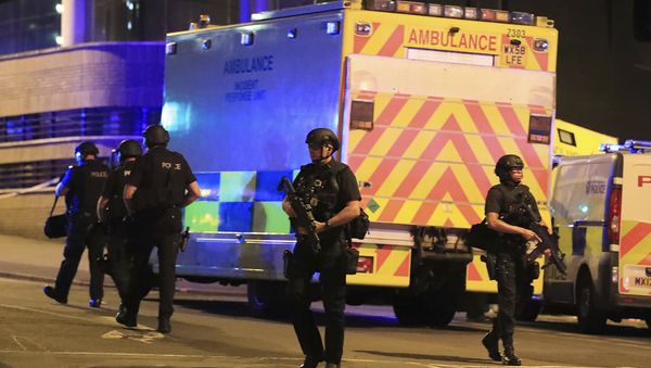 Police stand near an ambulance at Manchester Arena after reports of an explosion at the venue during an Ariana Grande concert on Monday, May 22, 2017. Police stand near an ambulance at Manchester Arena after reports of an explosion at the venue during an Ariana Grande concert on Monday, May 22, 2017. - Sputnik International