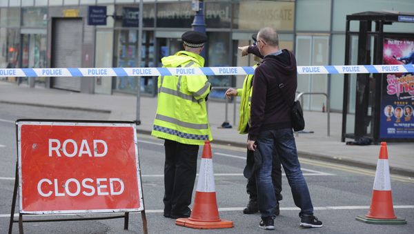 Police block a road near to the Manchester Arena in central Manchester, England Tuesday, May 23, 2017. Police block a road near to the Manchester Arena in central Manchester, England Tuesday, May 23, 2017. - Sputnik International