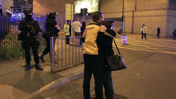Armed police stand guard at Manchester Arena after reports of an explosion at the venue during an Ariana Grande gig in Manchester, England Monday, May 22, 2017. - Sputnik International