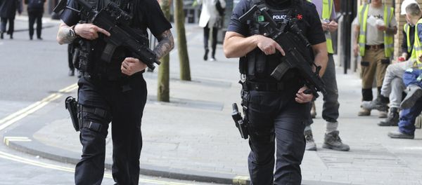 Armed police patrol the streets near to Manchester Arena in central Manchester, England, Tuesday May 23, 2017. - Sputnik International