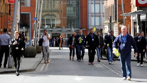 People rush out of the Arndale shopping centre as it is evacuated in Manchester, Britain May 23, 2017. People rush out of the Arndale shopping centre as it is evacuated in Manchester, Britain May 23, 2017. - Sputnik International