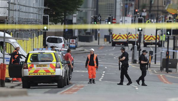 Police guard close to the Manchester Arena in Manchester, Britain a day after an explosion Police guard close to the Manchester Arena in Manchester, Britain a day after an explosion - Sputnik International