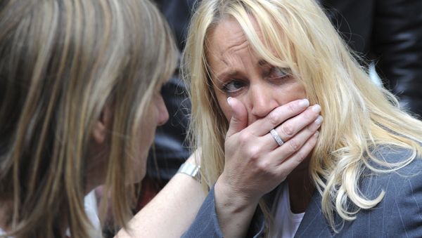 A member of the public reacts as police evacuate the Arndale shopping centre, in Manchester, England Tuesday May 23, 2017, the day after an apparent suicide bomber attacked an Ariana Grande concert as it ended Monday night, killing over a dozen of people among a panicked crowd of young concertgoers. - Sputnik International