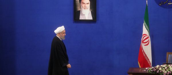 Iranian president Hassan Rouhani arrives for a news conference in Tehran, Iran, May 22, 2017. Iranian president Hassan Rouhani arrives for a news conference in Tehran, Iran, May 22, 2017. - Sputnik International