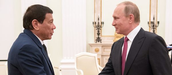 President Vladimir Putin at a meeting with President of the Philippines Rodrigo Duterte, left President Vladimir Putin at a meeting with President of the Philippines Rodrigo Duterte, left - Sputnik International