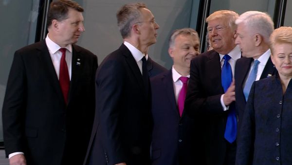 In this image taken from NATO TV, Montenegro Prime Minister Dusko Markovic, second right, appears to be pushed by US President Donald Trump In this image taken from NATO TV, Montenegro Prime Minister Dusko Markovic, second right, appears to be pushed by US President Donald Trump - Sputnik International