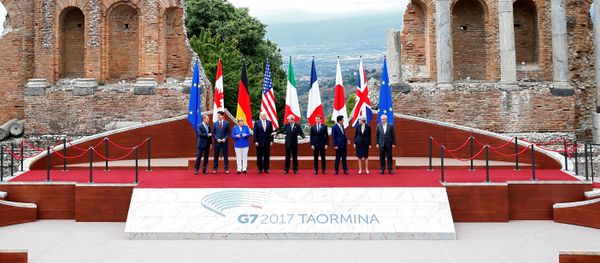 From L-R, European Council President Donald Tusk, Canadian Prime Minister Justin Trudeau, German Chancellor Angela Merkel, U.S. President Donald Trump, Italian Prime Minister Paolo Gentiloni, French President Emmanuel Macron, Japanese Prime Minister Shinzo Abe, Britain’s Prime Minister Theresa May and European Commission President Jean-Claude Juncker pose for a family photo during the G7 Summit in Taormina, Sicily, Italy, May 26, 2017. - Sputnik International