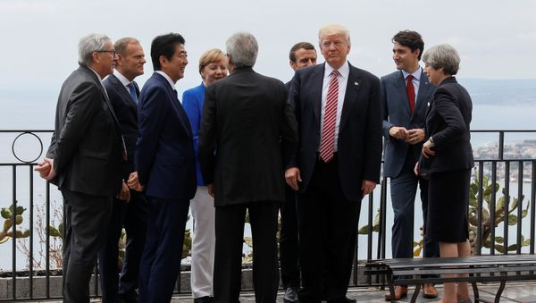 U.S. President Donald Trump gathers with (L-R) European Commission President Jean-Claude Juncker, European Council President Donald Tusk, Japanese Prime Minister Shinzo Abe, German Chancellor Angela Merkel, Italian Prime Minister Paolo Gentiloni, French President Emmanuel Macron, Canadian Prime Minister Justin Trudeau and Britain’s Prime Minister Theresa May as they attend the G7 Summit in Taormina, Sicily, Italy, May 26, 2017. - Sputnik International