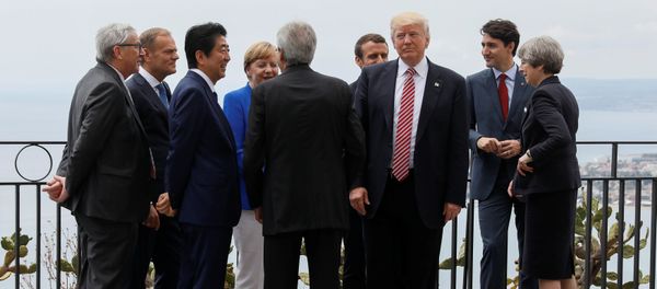 U.S. President Donald Trump gathers with (L-R) European Commission President Jean-Claude Juncker, European Council President Donald Tusk, Japanese Prime Minister Shinzo Abe, German Chancellor Angela Merkel, Italian Prime Minister Paolo Gentiloni, French President Emmanuel Macron, Canadian Prime Minister Justin Trudeau and Britain’s Prime Minister Theresa May as they attend the G7 Summit in Taormina, Sicily, Italy, May 26, 2017. - Sputnik International