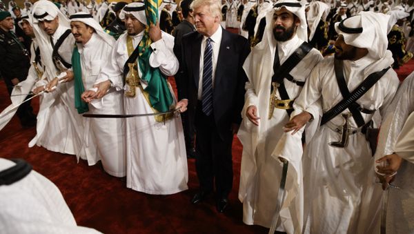 President Donald Trump holds a sword and sways with traditional dancers during a welcome ceremony at Murabba Palace in Riyadh President Donald Trump holds a sword and sways with traditional dancers during a welcome ceremony at Murabba Palace in Riyadh - Sputnik International