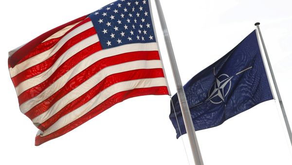 NATO and U.S. flags fly at the entrance of the Alliance's headquarters during a NATO foreign ministers meeting in Brussels, Belgium March 31, 2017 NATO and U.S. flags fly at the entrance of the Alliance's headquarters during a NATO foreign ministers meeting in Brussels, Belgium March 31, 2017 - Sputnik International