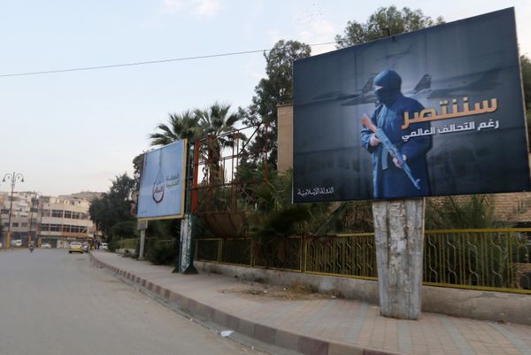 Islamic State billboards are seen along a street in Raqqa, eastern Syria. The billboard (R) reads: We will win despite the global coalition (File) Islamic State billboards are seen along a street in Raqqa, eastern Syria. The billboard (R) reads: We will win despite the global coalition (File) - Sputnik International