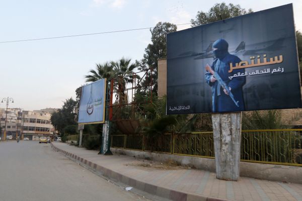 Islamic State billboards are seen along a street in Raqqa, eastern Syria. The billboard (R) reads: We will win despite the global coalition (File) - Sputnik International