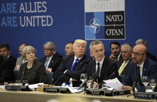 British Prime Minister Theresa May, U.S. President Donald Trump and NATO Secretary General Jens Stoltenberg listen to Belgian Prime Minister Charles Michel as he speaks during a working dinner meeting at the NATO headquarters during a NATO summit of heads of state and government in Brussels on Thursday, May 25, 2017 - Sputnik International