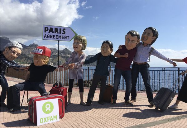 Oxfam activists wearing masks of the leaders of the G7 summit; from left, Italian Premier Paolo Gentiloni, US President Donald Trump, German Chancellor Angela Merkel, Japanese Prime Minister Shinzo Abe, French President Emmanuel Macron and Canadian Prime Minister Justin Trudeau, stage a demonstration in Giardini Naxos, near the venue of the G7 summit in the Sicilian town of Taormina, southern Italy, Friday, May 26, 2017 - Sputnik International