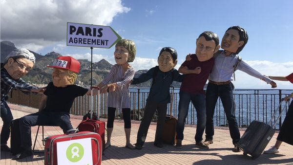 Oxfam activists wearing masks of the leaders of the G7 summit; from left, Italian Premier Paolo Gentiloni, US President Donald Trump, German Chancellor Angela Merkel, Japanese Prime Minister Shinzo Abe, French President Emmanuel Macron and Canadian Prime Minister Justin Trudeau, stage a demonstration in Giardini Naxos, near the venue of the G7 summit in the Sicilian town of Taormina, southern Italy, Friday, May 26, 2017 Oxfam activists wearing masks of the leaders of the G7 summit; from left, Italian Premier Paolo Gentiloni, US President Donald Trump, German Chancellor Angela Merkel, Japanese Prime Minister Shinzo Abe, French President Emmanuel Macron and Canadian Prime Minister Justin Trudeau, stage a demonstration in Giardini Naxos, near the venue of the G7 summit in the Sicilian town of Taormina, southern Italy, Friday, May 26, 2017 - Sputnik International