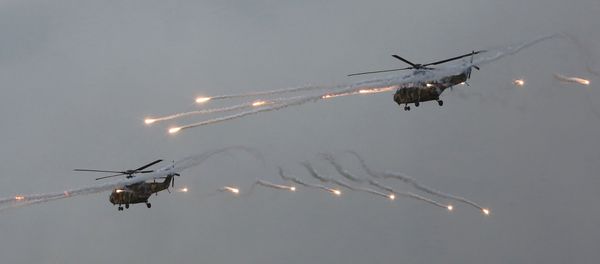 South Korean army Surion helicopters fire flares during a South Korea-U.S. joint military live-fire drills at Seungjin Fire Training Field in Pocheon, South Korea, South Korean army Surion helicopters fire flares during a South Korea-U.S. joint military live-fire drills at Seungjin Fire Training Field in Pocheon, South Korea, - Sputnik International