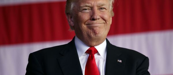 Trump smiles as he is introduced to speak to U.S. military troops and their families at Naval Air Station Sigonella, Saturday, May 27, 2017, in Sigonella, Italy. - Sputnik International