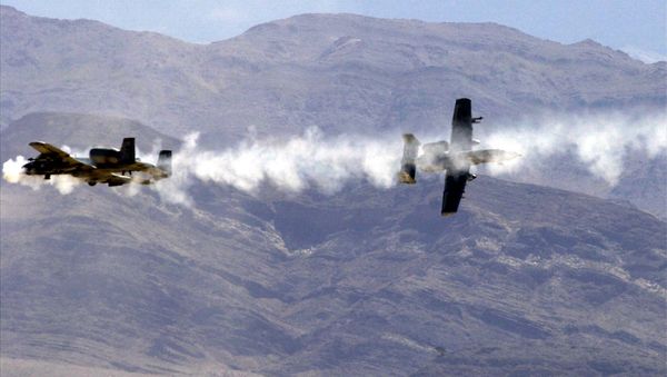 Two A-10 Warthogs firing their GAW 30mm Gatling guns - Sputnik International