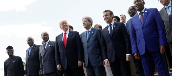 L-R Front Row: Nigeria's Vice-President Yemi Osinbajo, Kenya's President Uhuru Kenyatta, Guinea's President Alpha Conde, U.S. President Donald Trump, Italian Prime Minister Paolo Gentiloni, French President Emmanuel Macron, Niger's President Mahamadou Issoufou and Tunisian President Beji Caid Essebsi pose for a family photo with other participants of the G7 Summit expanded session in Taormina, Sicily, Italy May 27, 2017 - Sputnik International