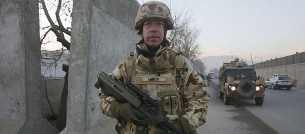 An Australian soldier Mark Larter with the International Security Assistant Force walks during a patrolling on Christmas day in Kabul, Afghanistan, on Thursday, Dec. 25, 2008 - Sputnik International