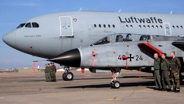 German airmen stand next to a fighter jet and a transport plane after the US Defense Secretary Ash Carter visited the Incirlik Air Base near Adana, Turkey, Tuesday, Dec. 15, 2015 - Sputnik International
