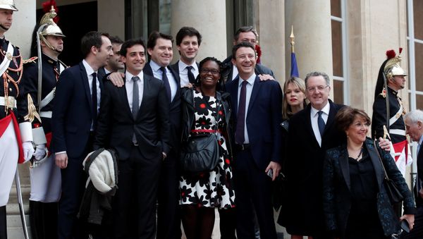 Emmanuel Macron's close team of the party's La Republique en marche (Republic on move) : Sibeth Ndiaye (C), Head of the public relations of the party, spokesman Benjamin Griveaux (C-R), Richard Ferrand, Julien Denormandie (4thL), Stephane Sejourne (2thL), Jean-Marie Girier (L), Sylvain Fort (3rdL) pose at the Elysee Palace prior to the handover ceremony for new French President Emmanuel Macron (unseen), in Paris, France, 14 May 2017 Emmanuel Macron's close team of the party's La Republique en marche (Republic on move) : Sibeth Ndiaye (C), Head of the public relations of the party, spokesman Benjamin Griveaux (C-R), Richard Ferrand, Julien Denormandie (4thL), Stephane Sejourne (2thL), Jean-Marie Girier (L), Sylvain Fort (3rdL) pose at the Elysee Palace prior to the handover ceremony for new French President Emmanuel Macron (unseen), in Paris, France, 14 May 2017 - Sputnik International