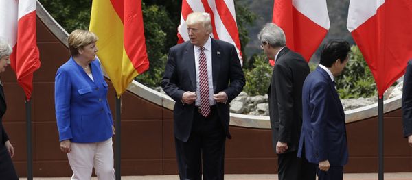 U.S. President Donald Trump, center, stands with other G7 leaders as they prepare for a group photo during the G7 Summit in the Ancient Theatre of Taormina ( 3rd century BC) in the Sicilian citadel of Taormina, Italy, Friday, May 26, 2017 U.S. President Donald Trump, center, stands with other G7 leaders as they prepare for a group photo during the G7 Summit in the Ancient Theatre of Taormina ( 3rd century BC) in the Sicilian citadel of Taormina, Italy, Friday, May 26, 2017 - Sputnik International