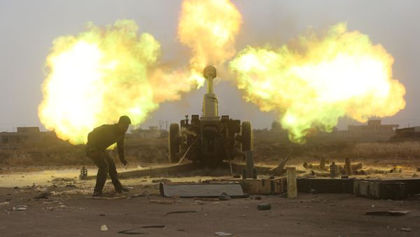 Popular Mobilization Forces (PMF) fire towards Islamic State militants during a battle on the outskirts of Al-Ba'aj, west of Mosul, Iraq May 26, 2017 - Sputnik International