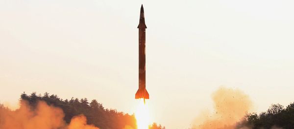 A ballistic rocket is test-fired through a precision control guidance system in this undated photo released by North Korea's Korean Central News Agency (KCNA) May 30, 2017 - Sputnik International