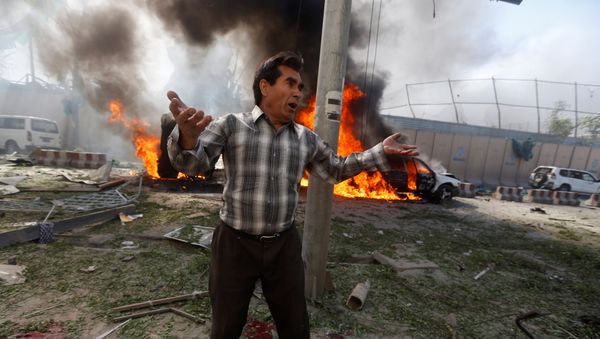An Afghan man reacts at the site of a blast in Kabul, Afghanistan May 31, 2017. An Afghan man reacts at the site of a blast in Kabul, Afghanistan May 31, 2017. - Sputnik International