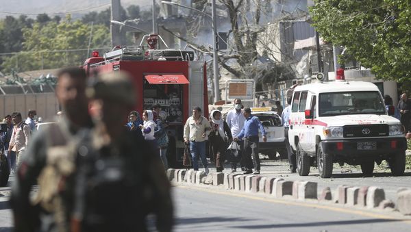 Security forces and medics work the site of a suicide attack in Kabul, Afghanistan - Sputnik International
