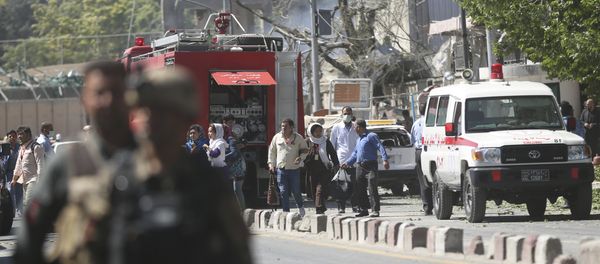 Security forces and medics work the site of a suicide attack in Kabul, Afghanistan Security forces and medics work the site of a suicide attack in Kabul, Afghanistan - Sputnik International