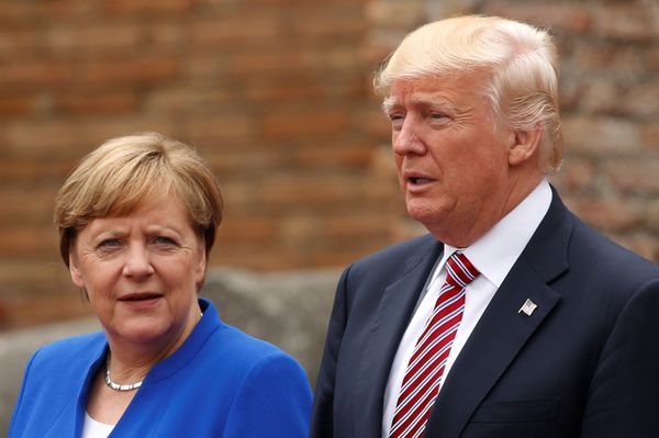 US President Donald Trump and German Chancellor Angela Merkel pose during a family photo at the Greek Theatee during a G7 summit in Taormina, Sicily, Italy, May 26, 2017.  - Sputnik International