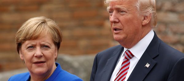 US President Donald Trump and German Chancellor Angela Merkel pose during a family photo at the Greek Theatee during a G7 summit in Taormina, Sicily, Italy, May 26, 2017. - Sputnik International