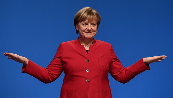 German Chancellor Angela Merkel gestures after addressing delegates during her conservative Christian Democratic Union (CDU) party's congress in Essen, western Germany, on December 6, 2016. - Sputnik International