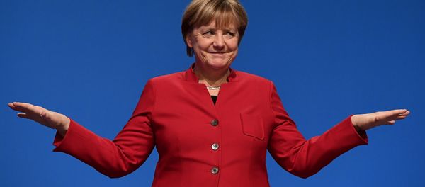 German Chancellor Angela Merkel gestures after addressing delegates during her conservative Christian Democratic Union (CDU) party's congress in Essen, western Germany, on December 6, 2016. German Chancellor Angela Merkel gestures after addressing delegates during her conservative Christian Democratic Union (CDU) party's congress in Essen, western Germany, on December 6, 2016. - Sputnik International