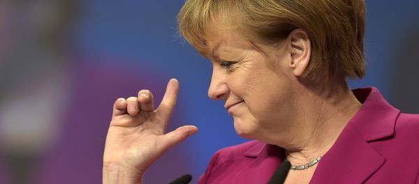 German Chancellor and chairwoman of the German Christian Democrats, CDU, Angela Merkel, points with her fingers during a visit to the convention venue prior to the 27. party convention in Cologne, Germany, Monday, Dec. 8, 2014. German Chancellor and chairwoman of the German Christian Democrats, CDU, Angela Merkel, points with her fingers during a visit to the convention venue prior to the 27. party convention in Cologne, Germany, Monday, Dec. 8, 2014. - Sputnik International