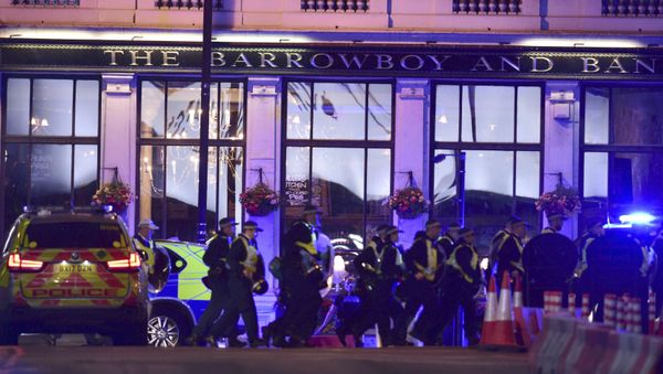 Police Officers walking on Borough High Street as police are dealing with an incident on London Bridge in London, Saturday, June 3, 2017. - Sputnik International
